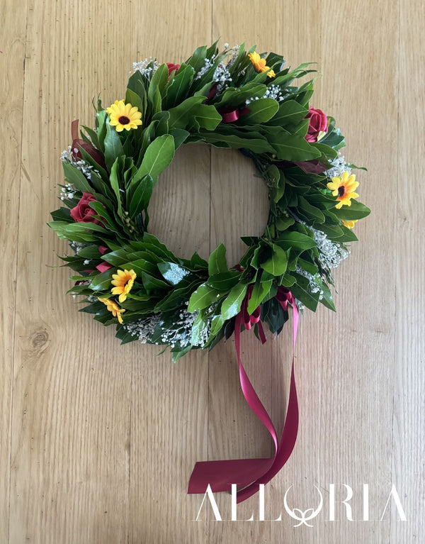 Corona di Alloro per Laurea con piccoli Girasoli, Roselline rosse e Velo da sposa sbiancato, fiocco bordeaux